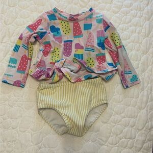 Ruffle Butts Pink Popsicle Print Rash Guard with Yellow Striped Bottom